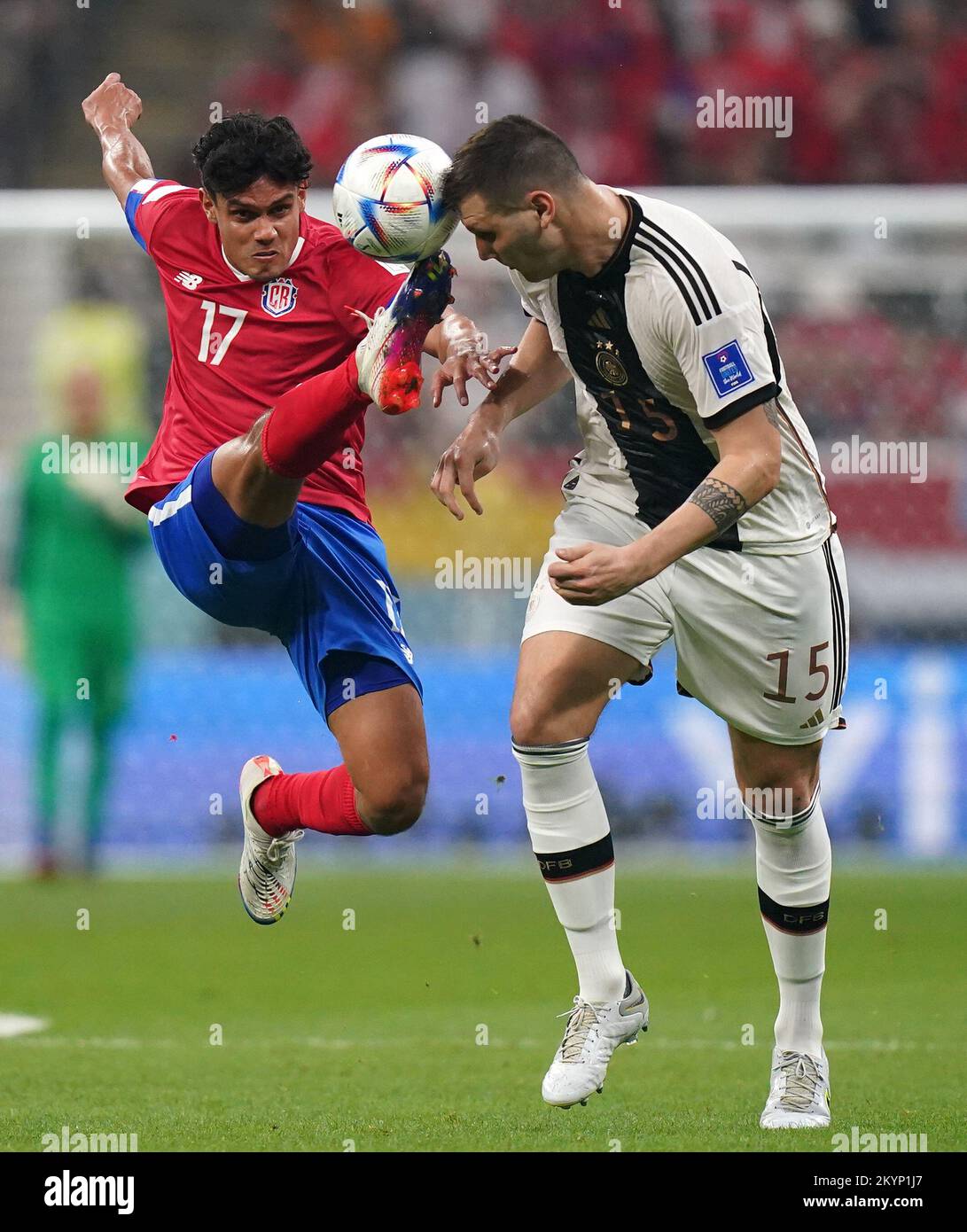 Costa Rica's Yeltsin Tejeda (left) and Germany's Niklas Suele battle for the ball during the FIFA World Cup Group E match at the Al Bayt Stadium, Al Khor, Qatar. Picture date: Thursday December 1, 2022. Stock Photo