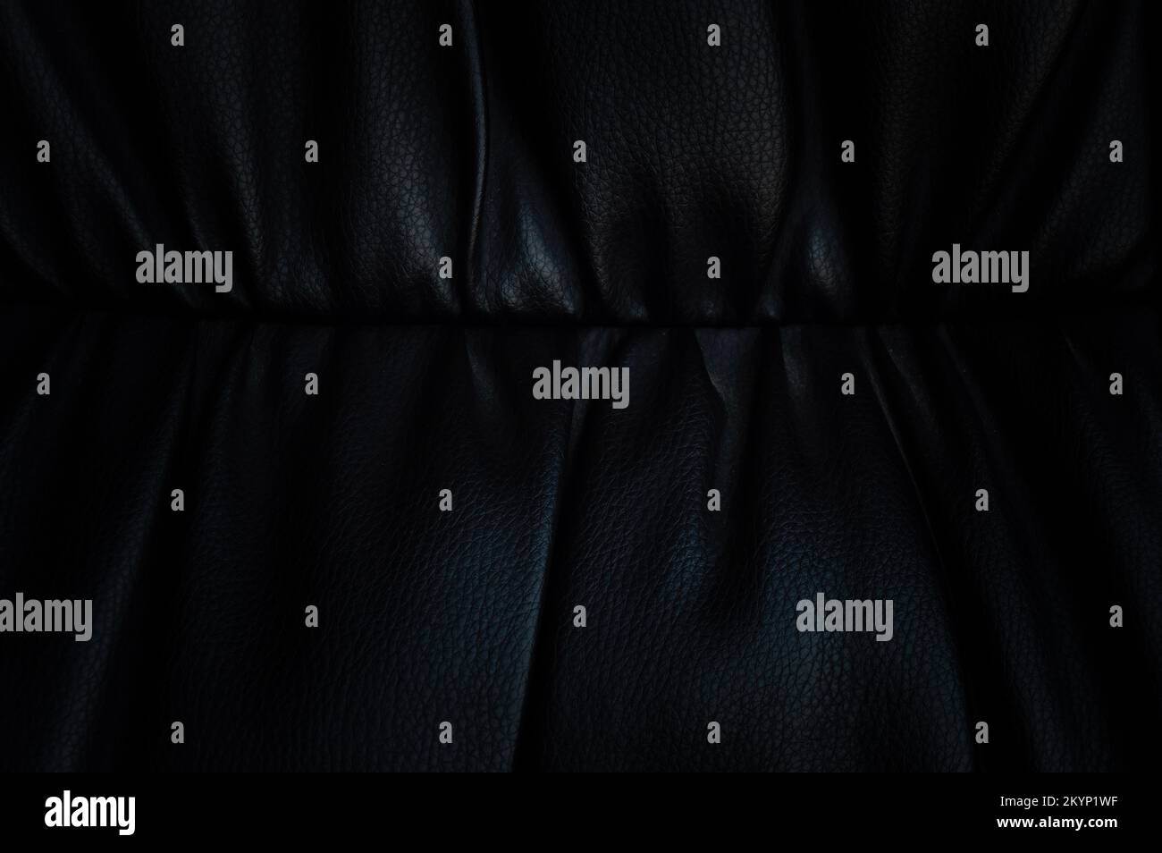 Black leather background in darkness Stock Photo