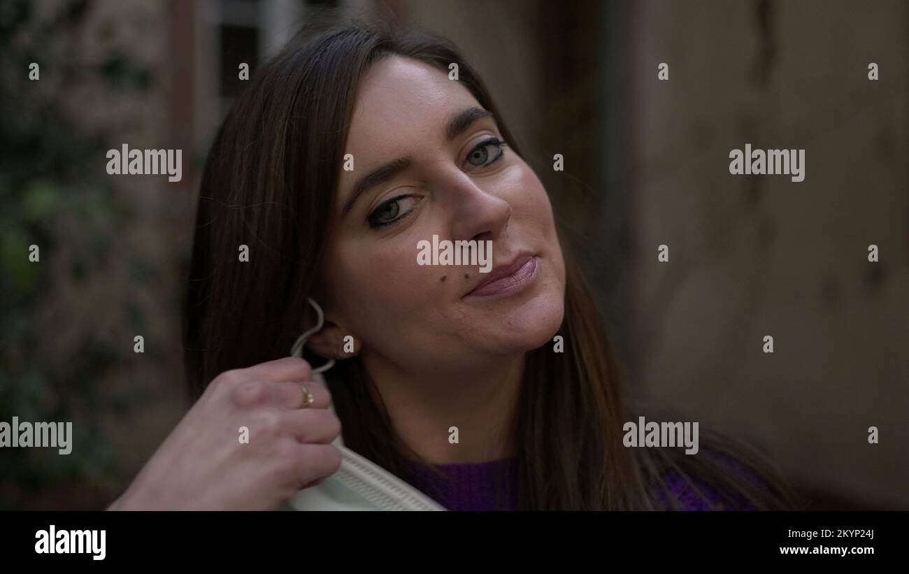 Woman removing covid mask hi-res stock photography and images - Alamy