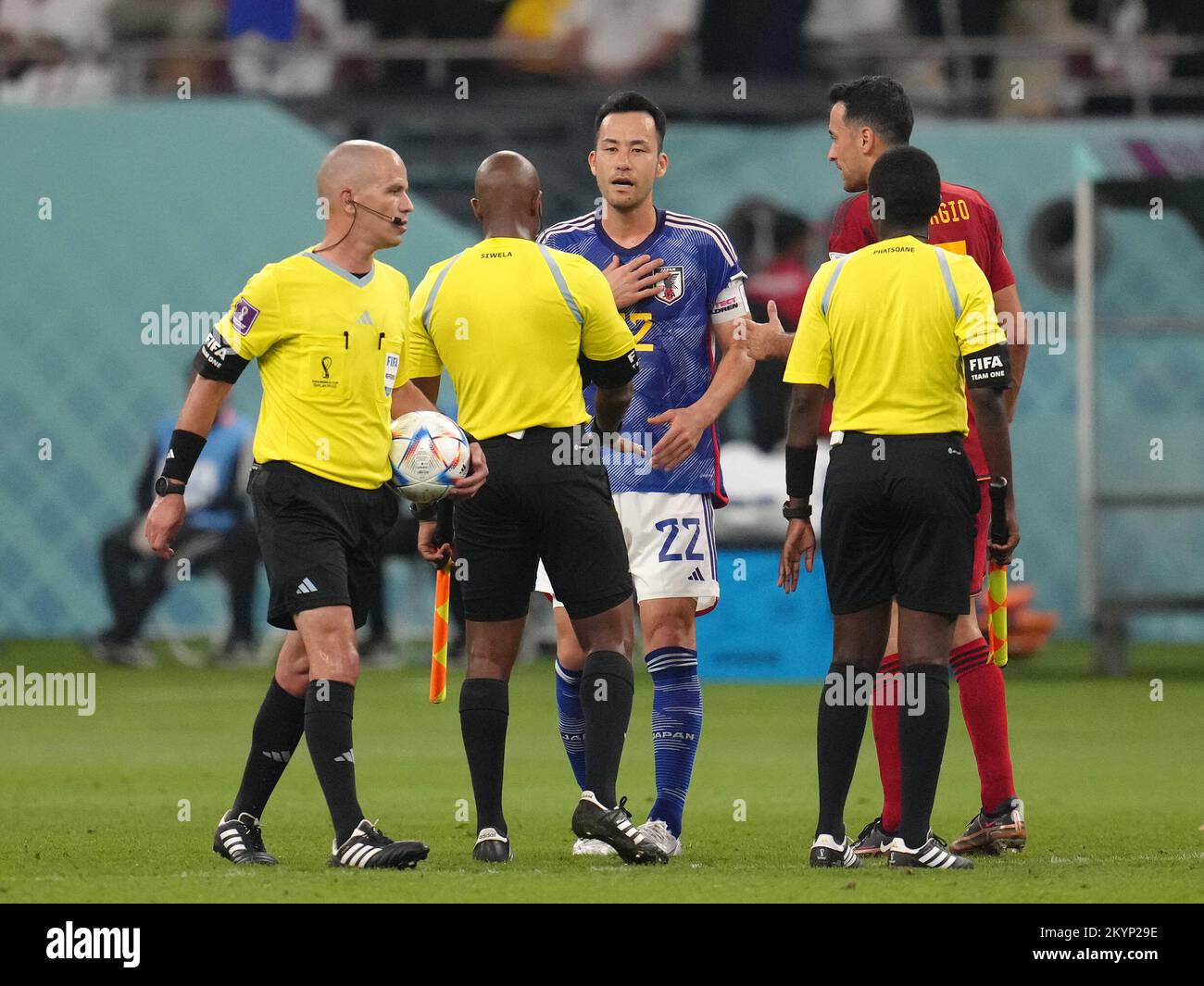 Japan's Maya Yoshida tries to speak with referee Victor Gomes at the end of the first half during the FIFA World Cup Group E match at the Khalifa International Stadium, Al Rayyan, Qatar. Picture date: Thursday December 1, 2022. Stock Photo