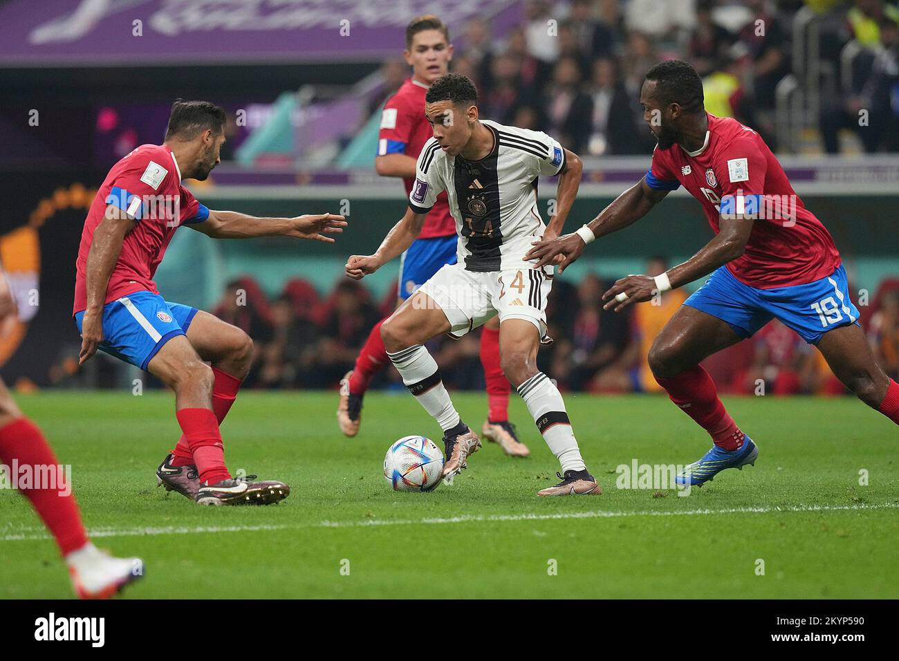 December 1st, 2022, Al Bayt Stadium, Doha, QAT, World Cup FIFA 2022, Group E, Costa Rica vs Germany, in the picture Costa Rica's midfielder Celso Borges, Germany's midfielder Jamal Musiala, Costa Rica's defender Kendall Waston Stock Photo