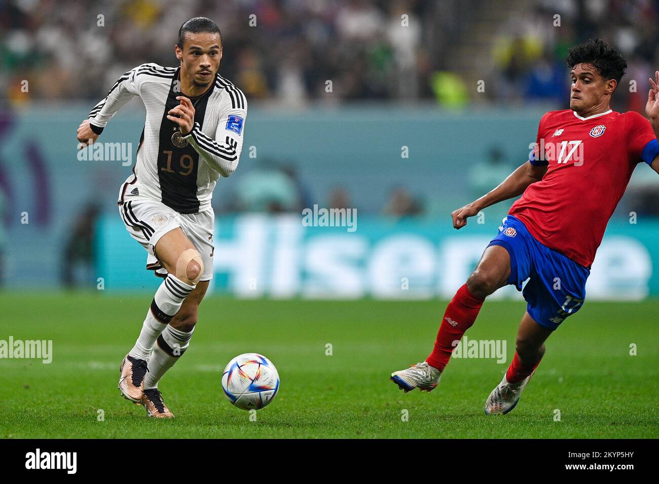 AL KHOR, QATAR - DECEMBER 1: Leroy Sane of Germany battles for the ball with Yeltsin Tejeda of Costa Rica during the Group E - FIFA World Cup Qatar 2022 match between Costa Rica and Germany at the Al Bayt Stadium on December 1, 2022 in Al Khor, Qatar (Photo by Pablo Morano/BSR Agency) Stock Photo
