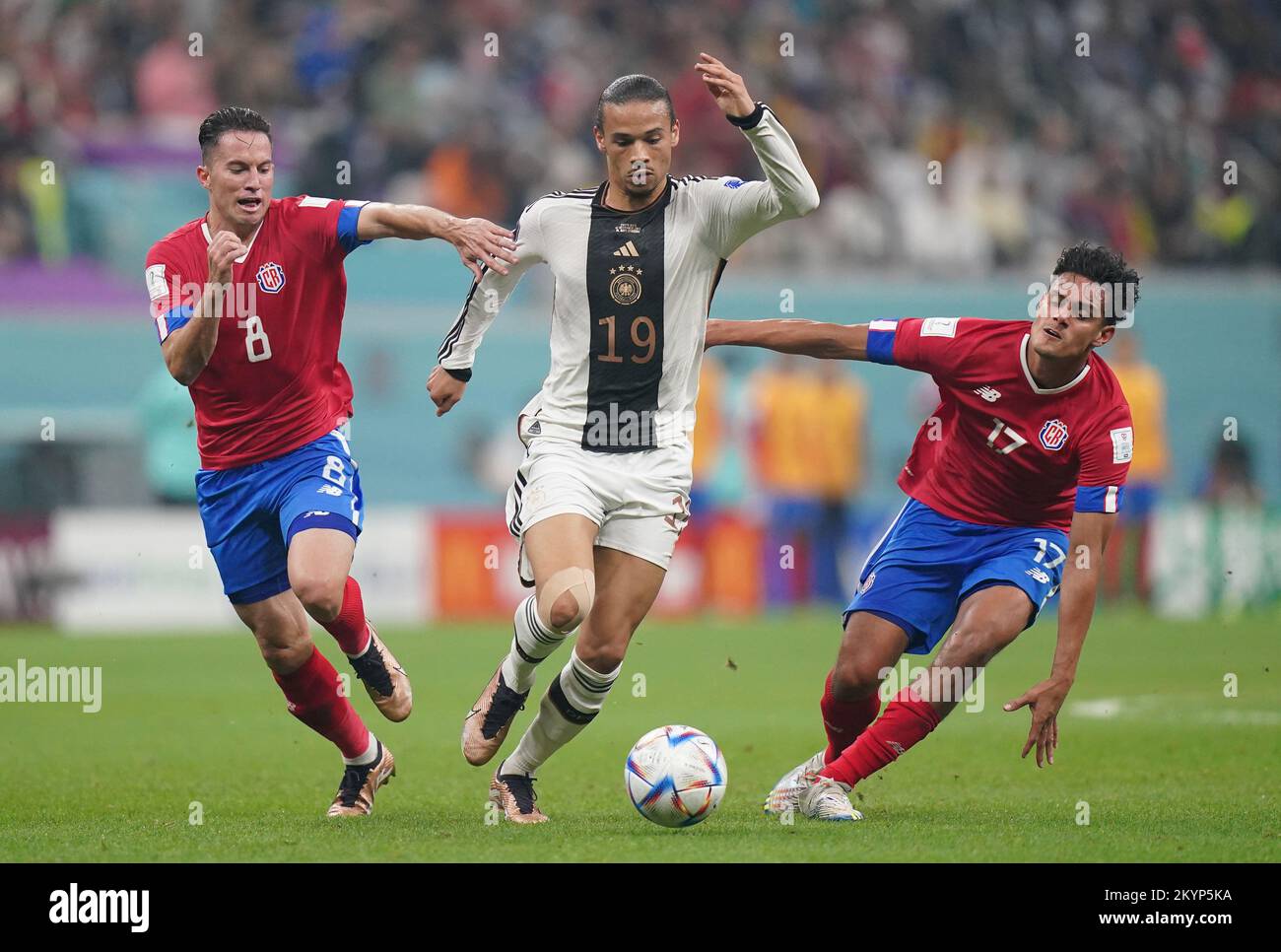 Germany's Leroy Sane (centre) under pressure from Costa Rica's Bryan Oviedo (left) and Yeltsin Tejeda during the FIFA World Cup Group E match at the Al Bayt Stadium, Al Khor, Qatar. Picture date: Thursday December 1, 2022. Stock Photo