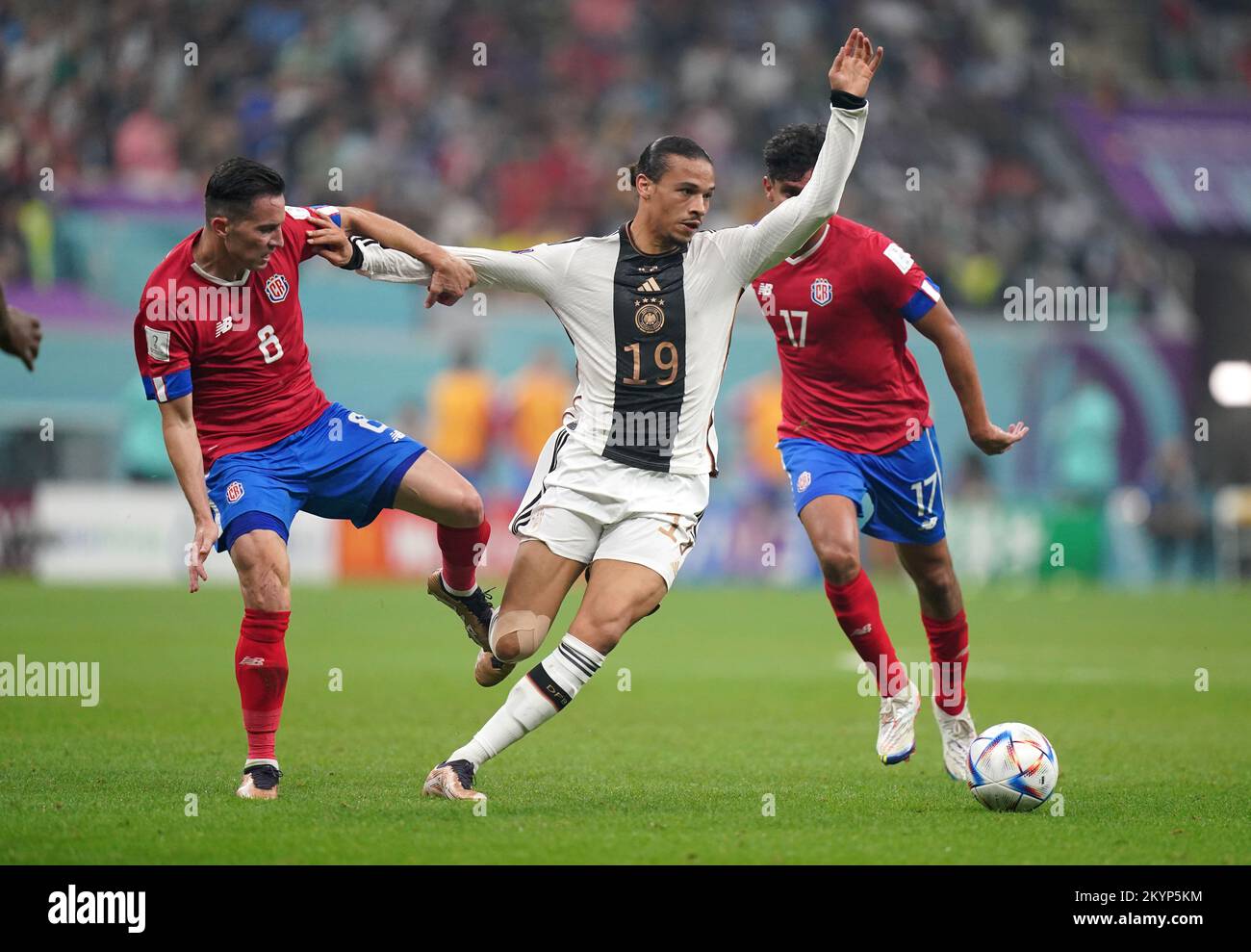 Germany's Leroy Sane (centre) under pressure from Costa Rica's Bryan Oviedo (left) and Yeltsin Tejeda during the FIFA World Cup Group E match at the Al Bayt Stadium, Al Khor, Qatar. Picture date: Thursday December 1, 2022. Stock Photo