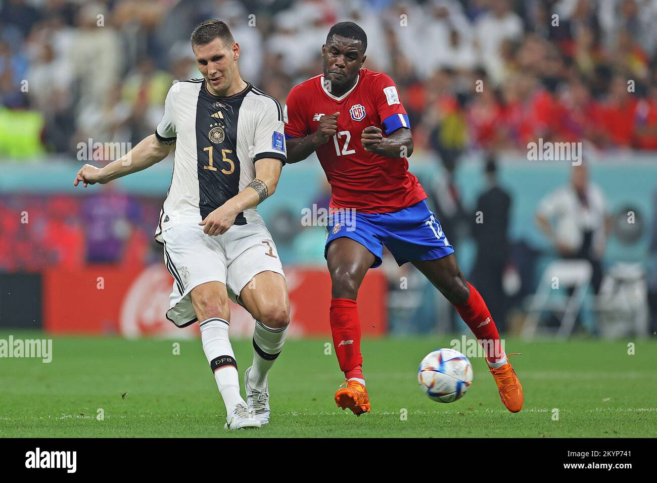 1st December 2022; Al Bayt Stadium, Al Khor, Qatar; FIFA World Cup Football, Costa Rica versus Germany; Joel Campbell of Costa Rica challenged by Niklas Sule of Germany Stock Photo