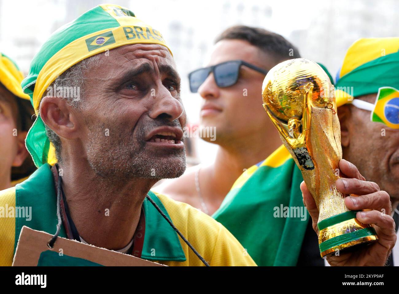 Brazilian fans supporting national soccer team playing Fifa World Cup at Fan Festival arena Stock Photo