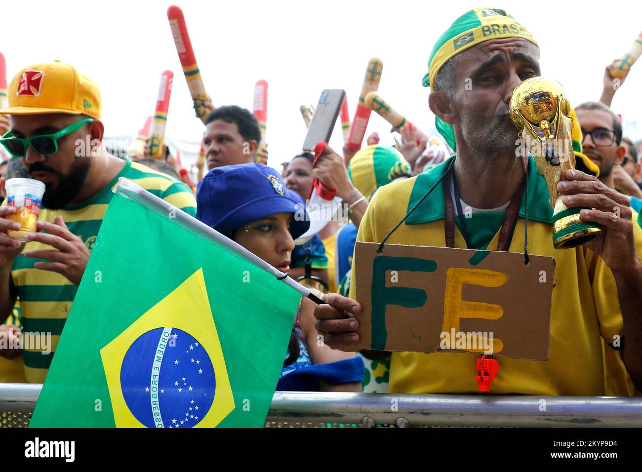 Brazilian fans supporting national soccer team playing Fifa World Cup at Fan Festival arena