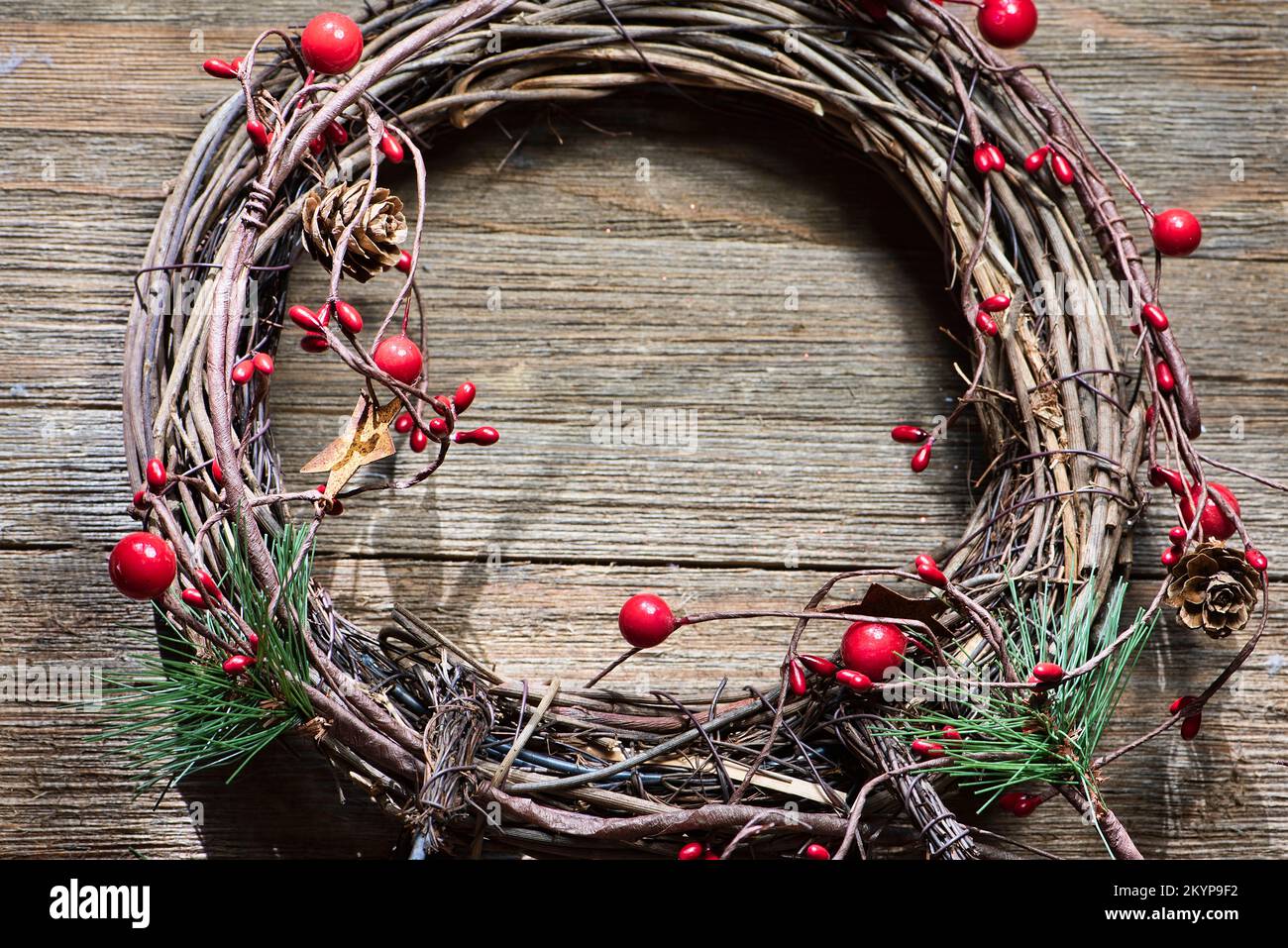Small grape vine wreath with rustic and traditional decorations, room for text, Stock Photo
