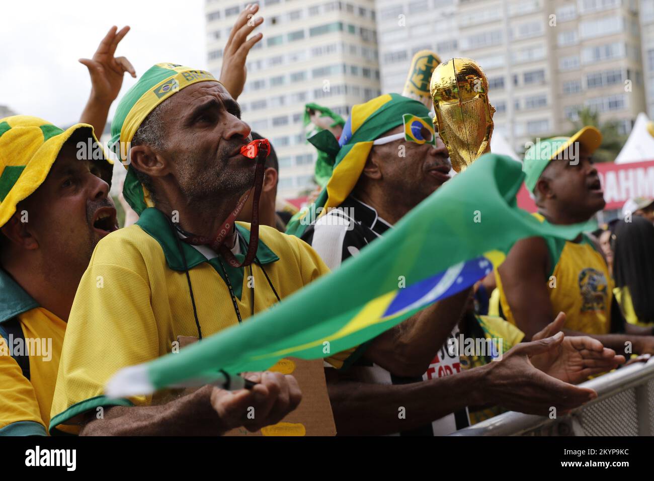 Brazilian fans supporting national soccer team playing Fifa World Cup at Fan Festival arena Stock Photo