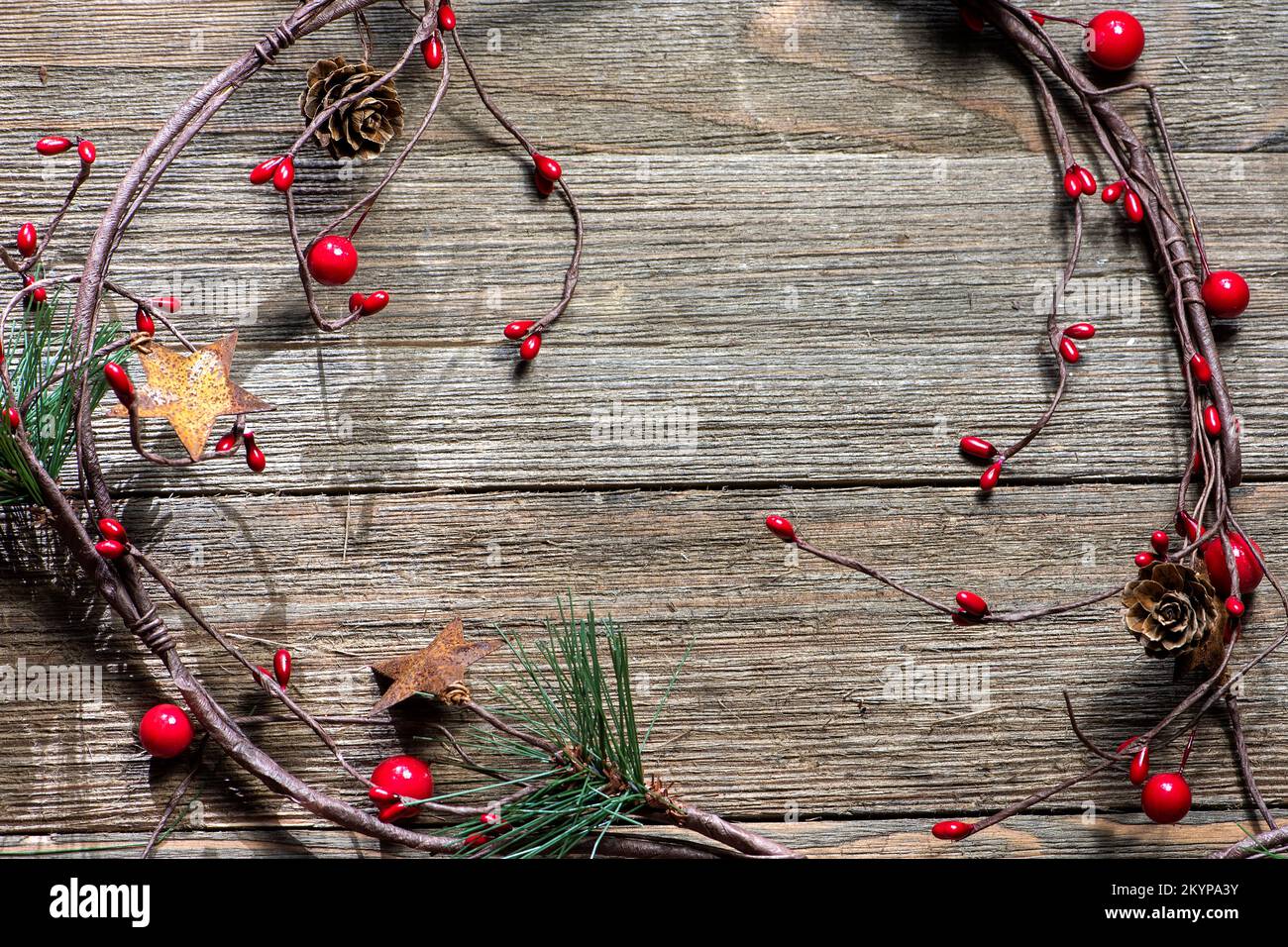 Grape vine traditional Christmas decorations, farmhouse style, on a wooden background, no text Stock Photo