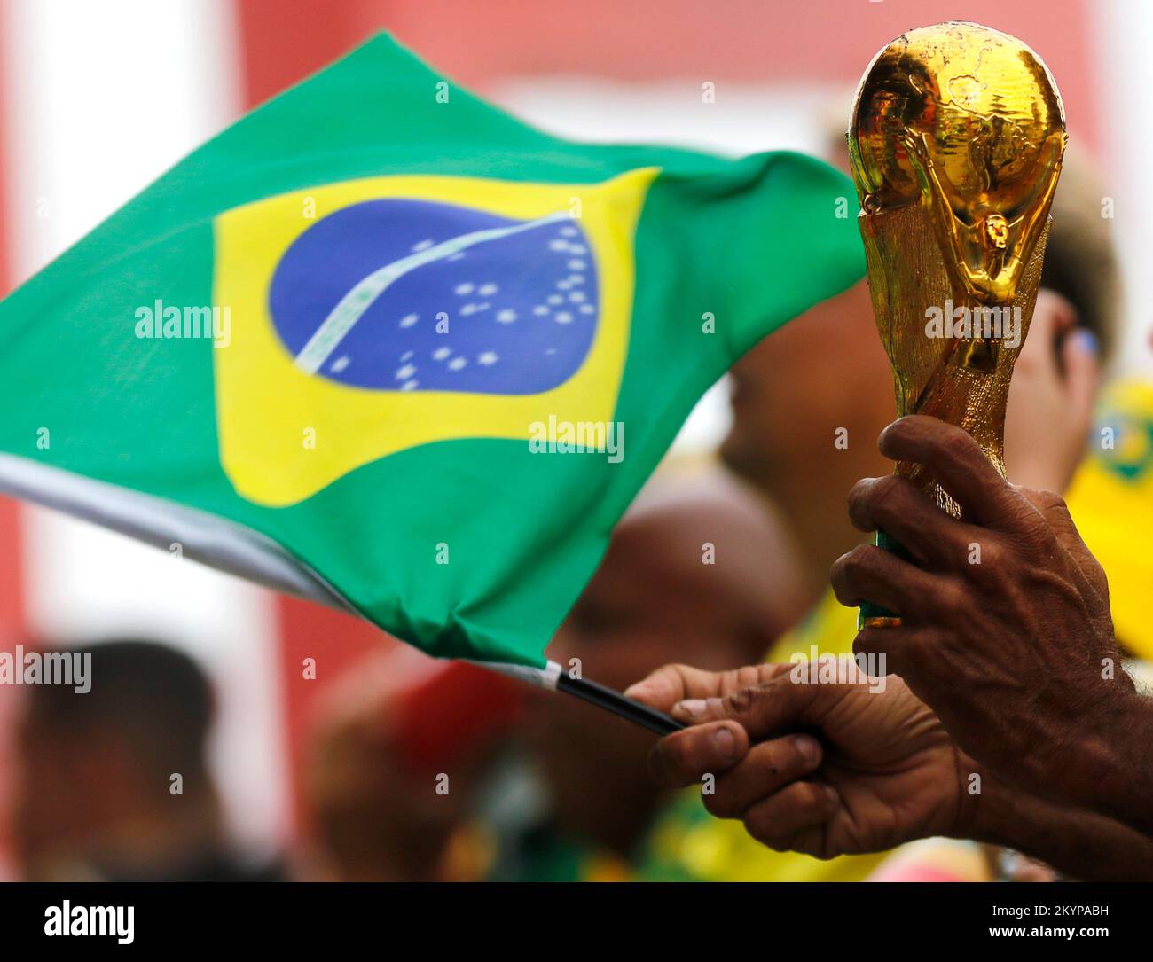 Fifa World Cup trophy replica close up detail and brazilian flag