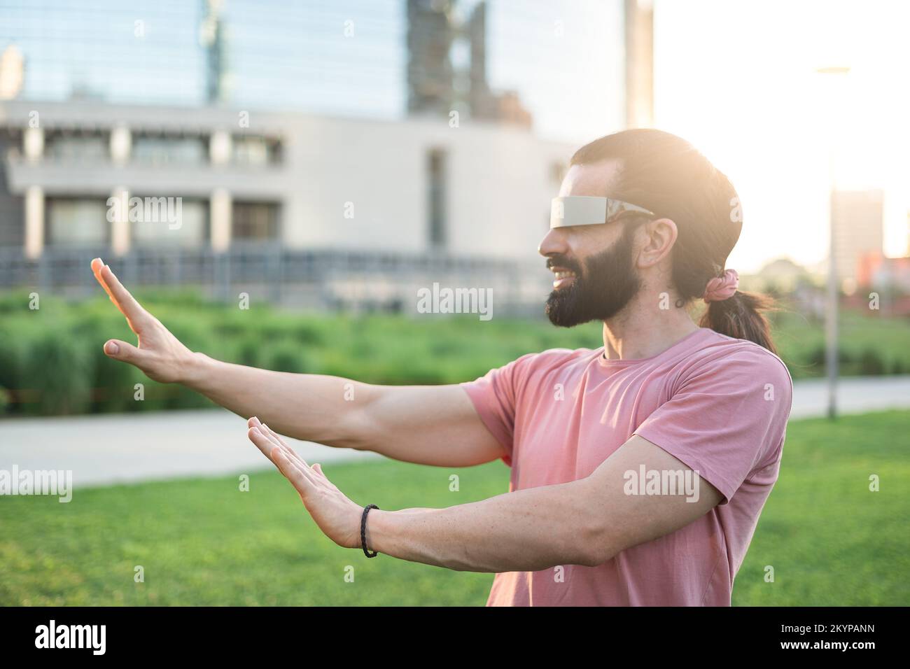 Young hispanic man wearing vr glasses Stock Photo