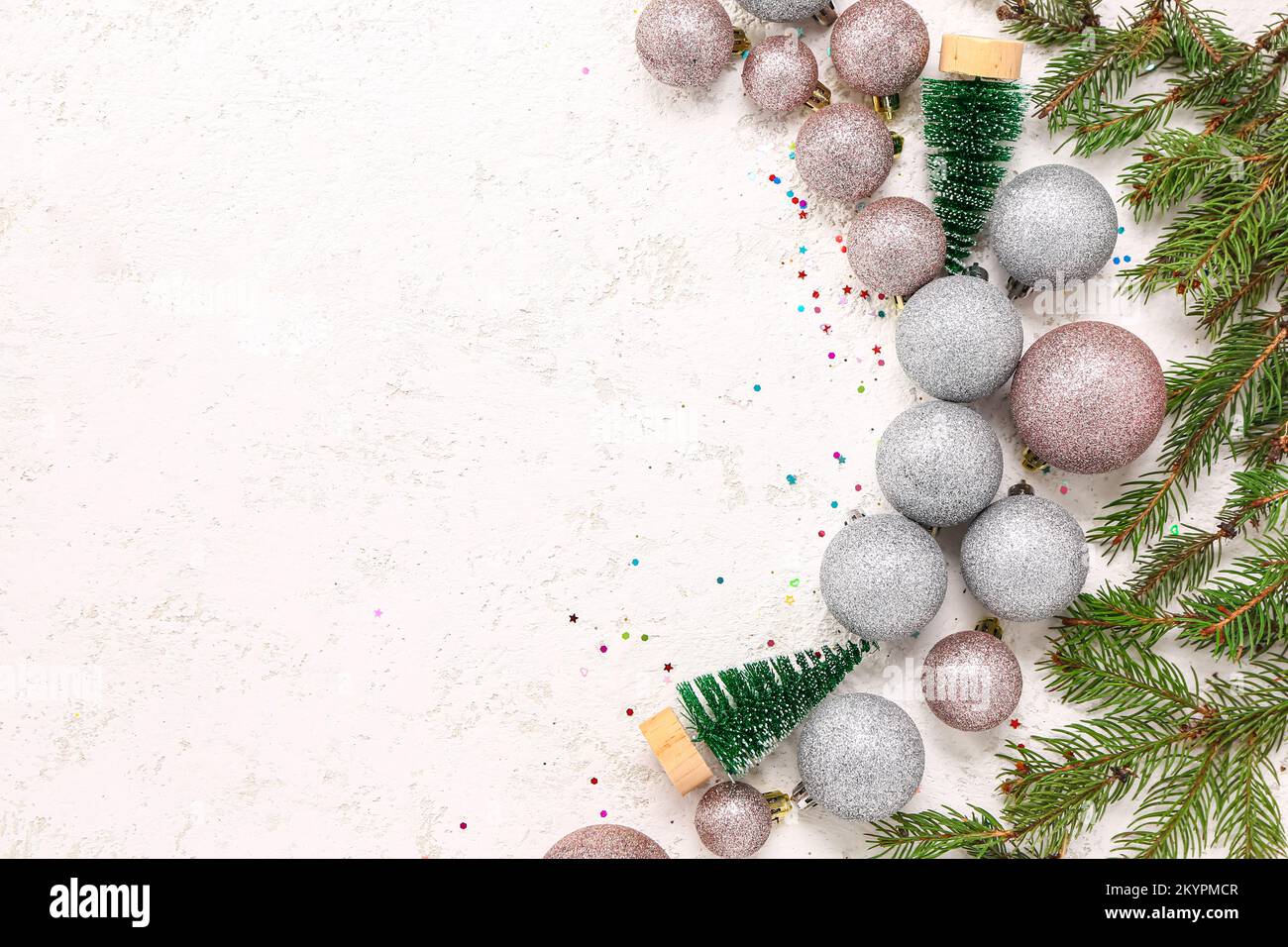 Christmas balls with fir trees and branches on white background Stock ...