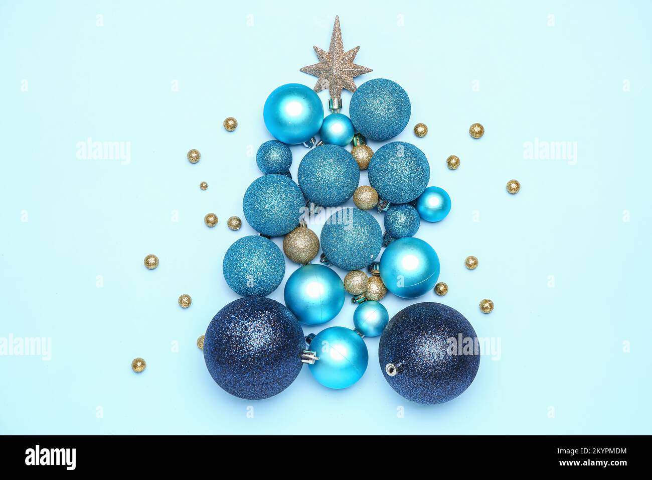 Christmas tree made of Christmas balls with star on blue background ...