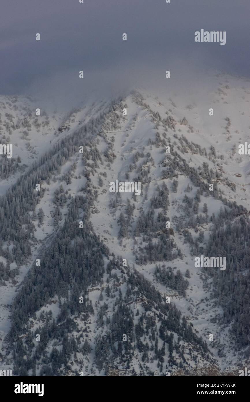 Vertical Utah Mountain Peak covered in Snow Stock Photo