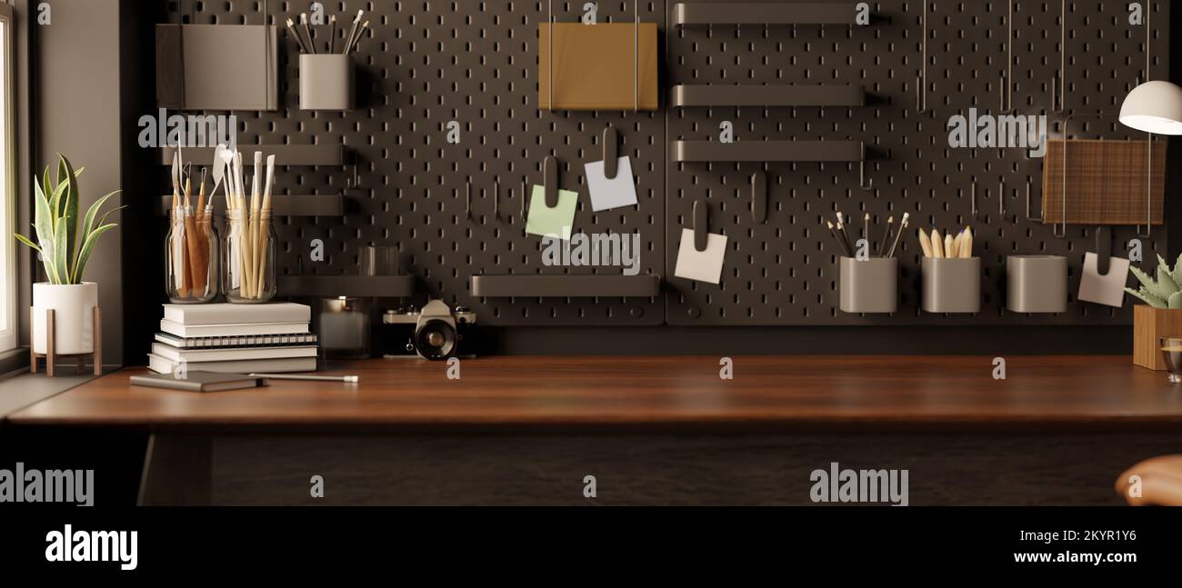 Modern black home office space with accessories, decor and copy space