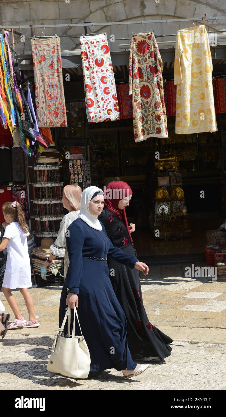 Palestinian women walking through Omar Ibn El-Khattab Sq. near Jaffa gate in the old city of Jerusalem. Stock Photo