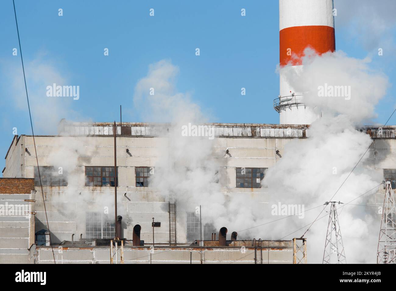 Emission of caustic toxic steam smoke at the plant industry and