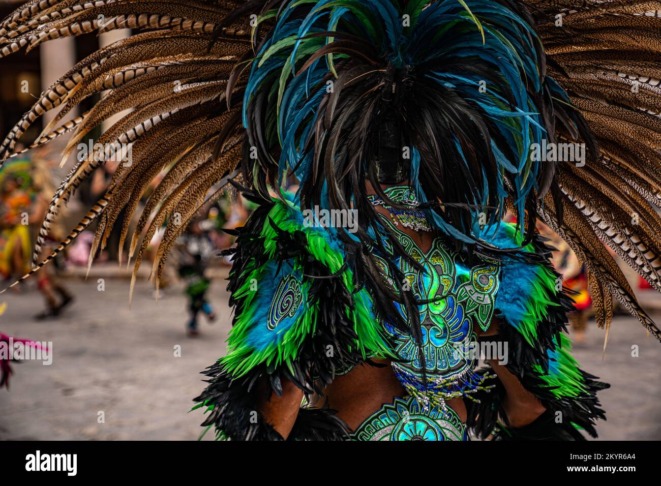 Back side of a vibrant green and blue head dress at the Danza de Indios gathering of native tribes in San Miguel de Allende, Mexico Stock Photo