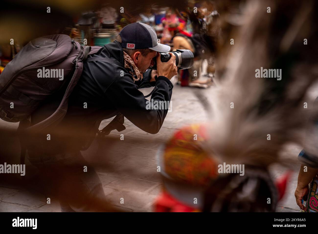 Professional photographer snapping pics at the Danza de Indios gathering of native tribes in San Miguel de Allende, Mexico Stock Photo