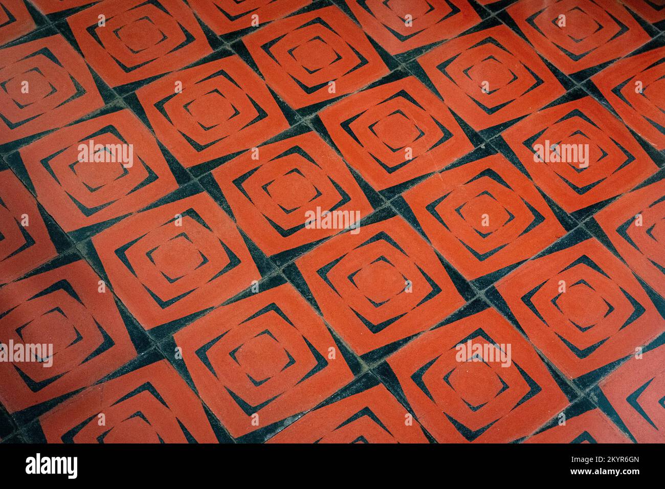 Marroon and black cement tiled floor in Oaxaca City, Mexico Stock Photo