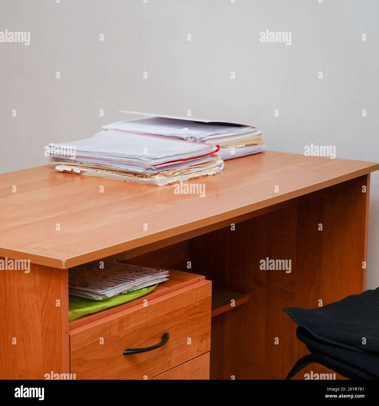 A stack of papers on a desktop without a computer Stock Photo
