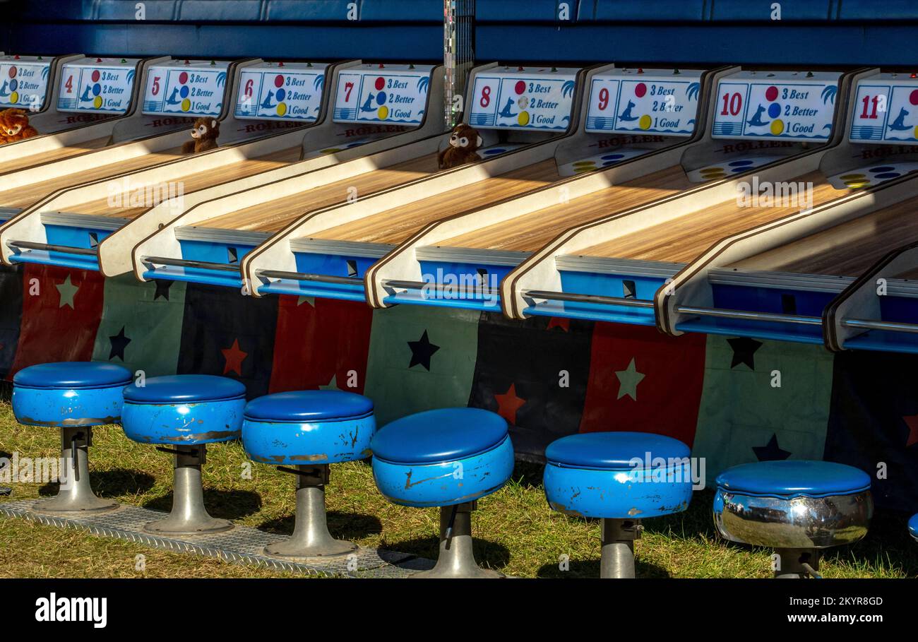 wood alleys and wooden balls rack up points for prizes in this fun game at a county fair and carnival Stock Photo