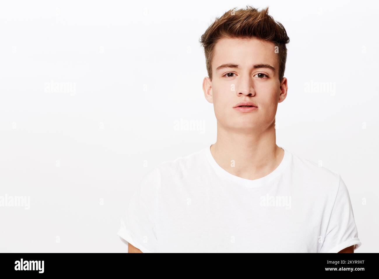 Cool and confident. Head and shoulders portrait of a young man looking at the camera Stock Photo
