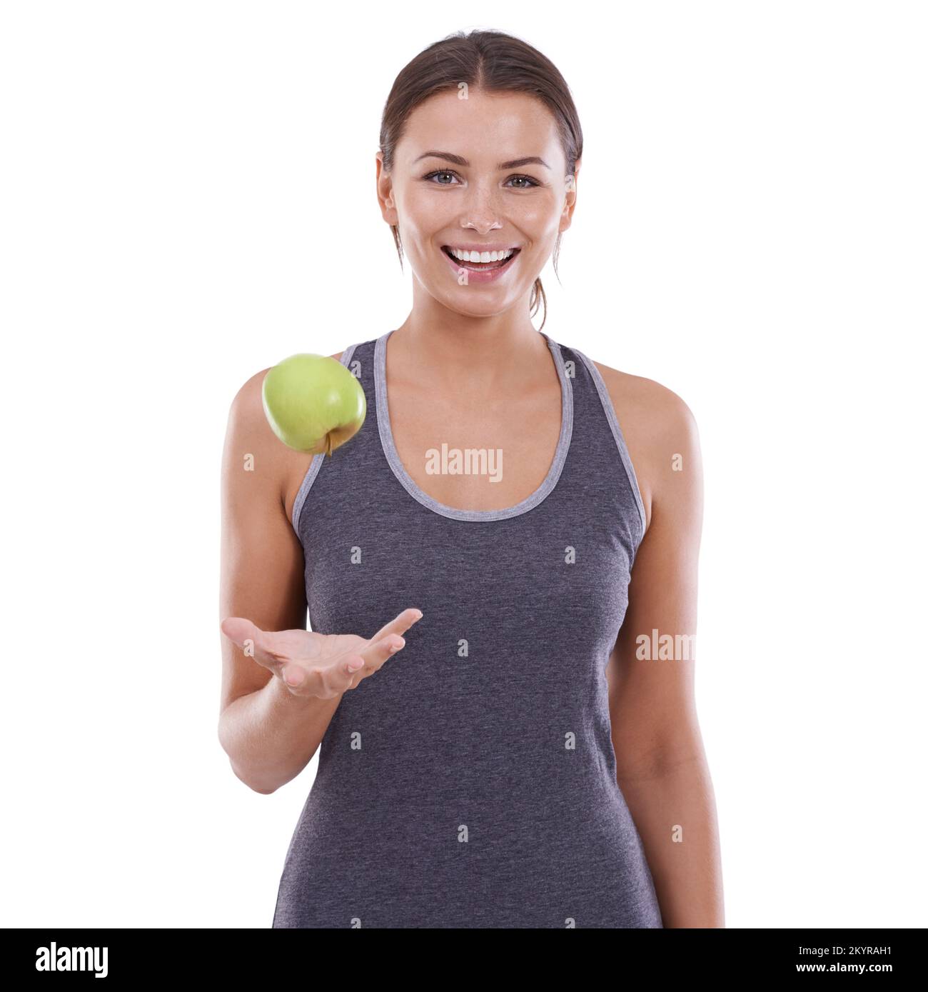 Making the healthy choice. A young woman smiling at the camera while