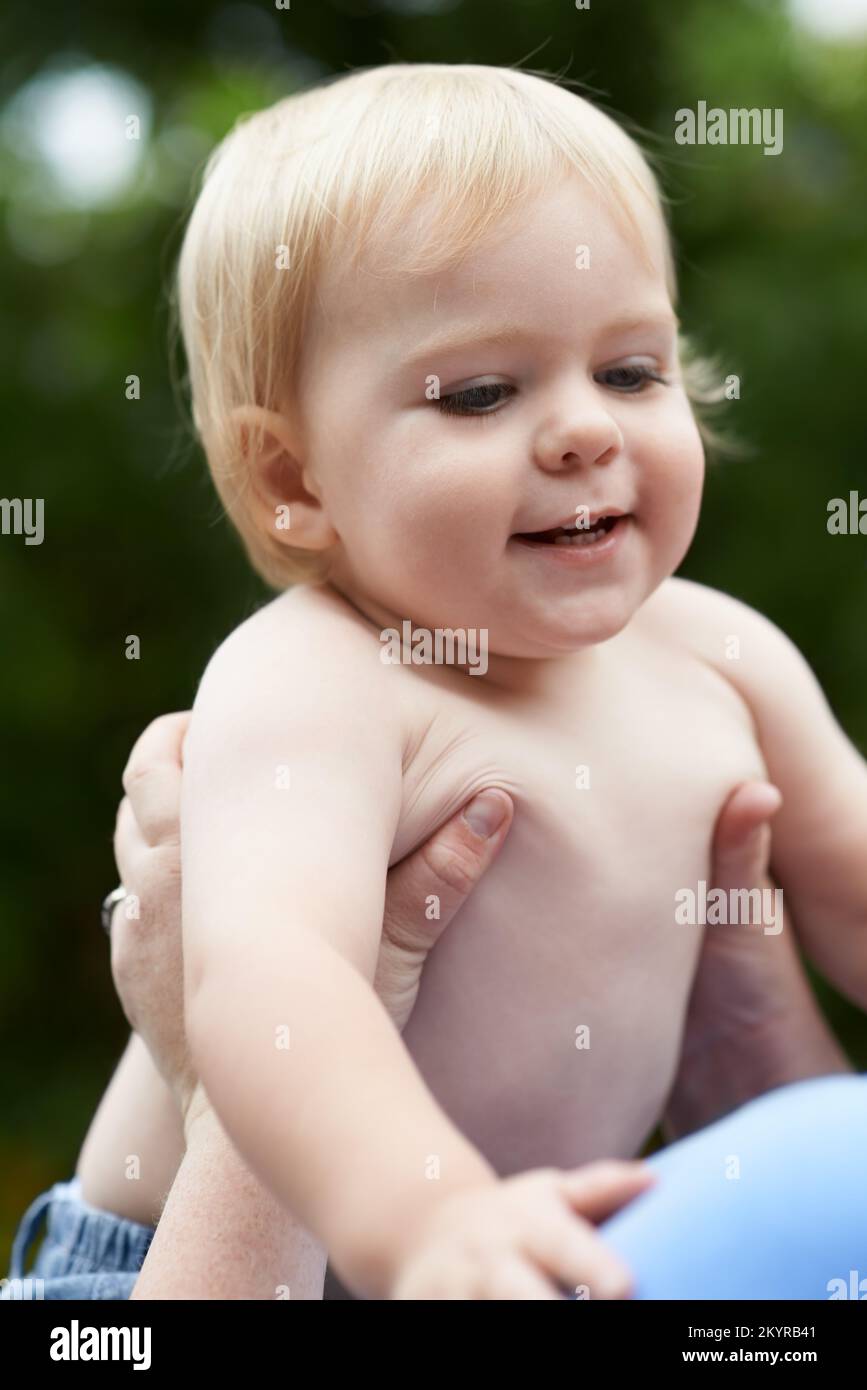 He loves his mommy so much. a baby boy playing with his mother Stock