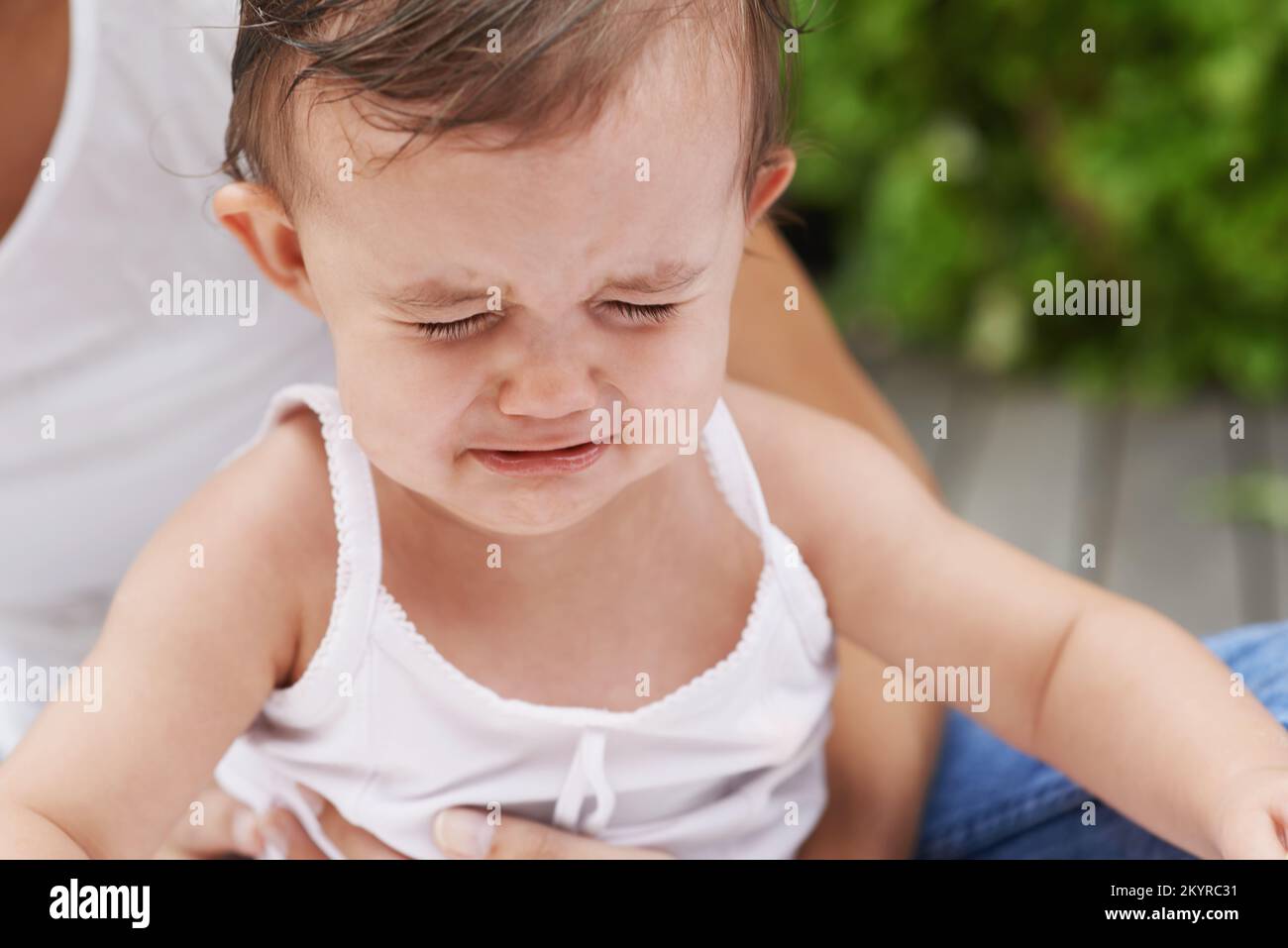 Mommys always around. a little baby girl with her mother Stock Photo