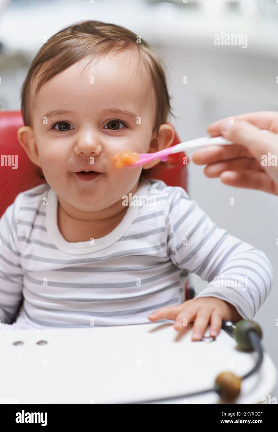 Baby fed high chair smile hires stock photography and images Alamy
