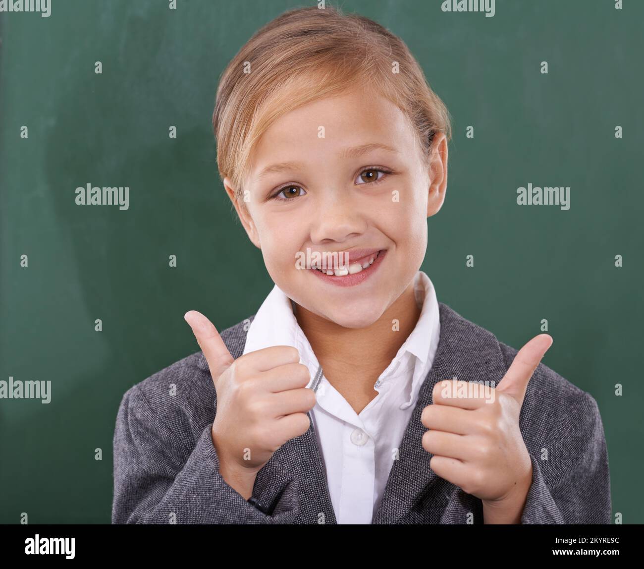 Shes ready to learn. Portrait of a young schoolgirl standing in front