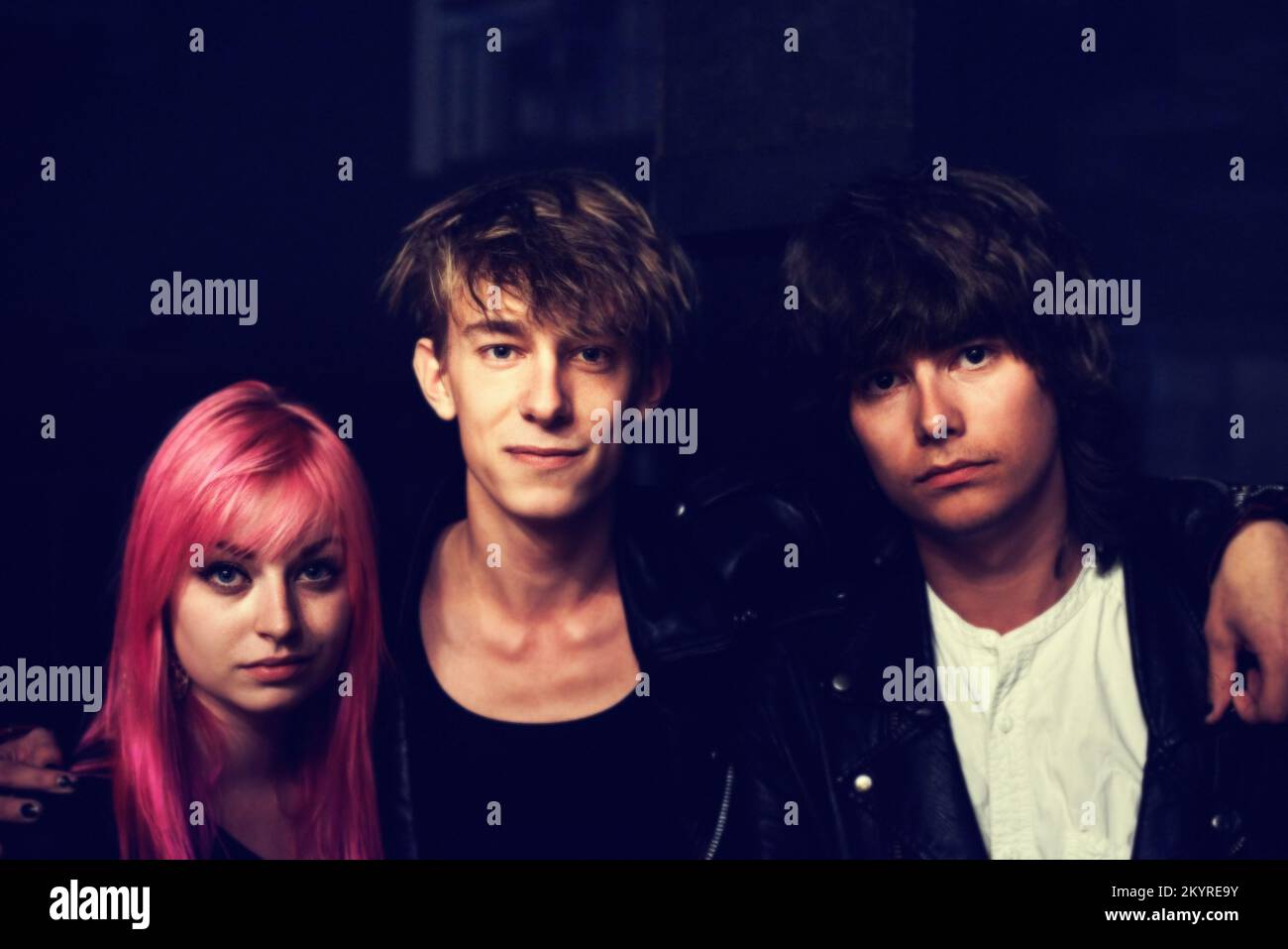 Were the band. A trio of musicians standing together and looking cool Stock Photo Alamy