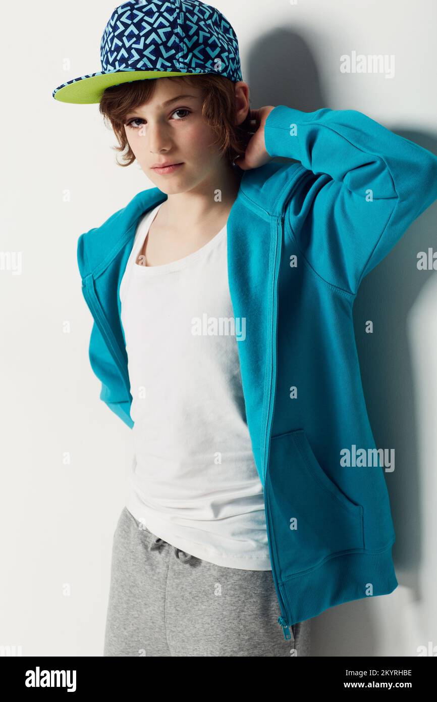 Trendy preteen. Cute preteen boy wearing trendy clothing while isolated on white. Stock Photo