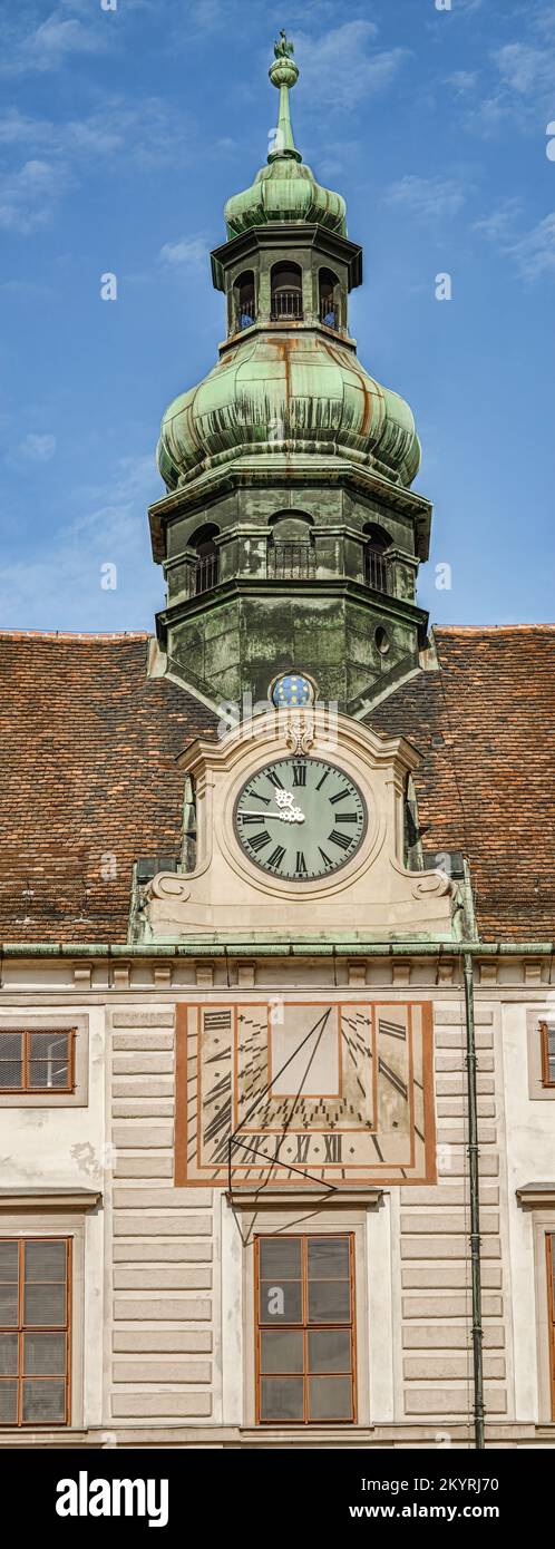 Facade of Amalienburg with sundial and clock, Vienna, Austria Stock Photo
