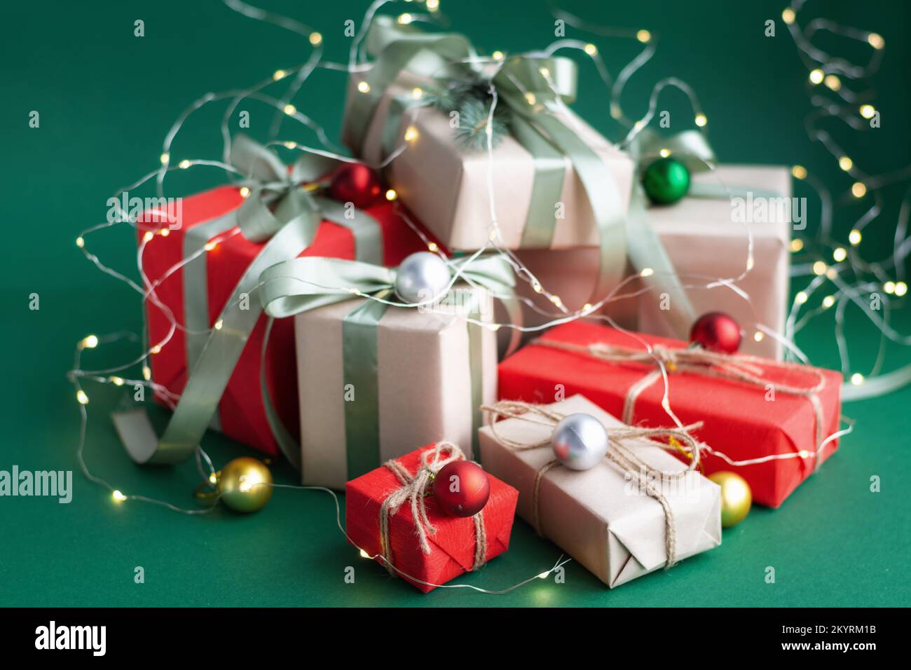 Christmas gift and decorations on green background. Stock Photo