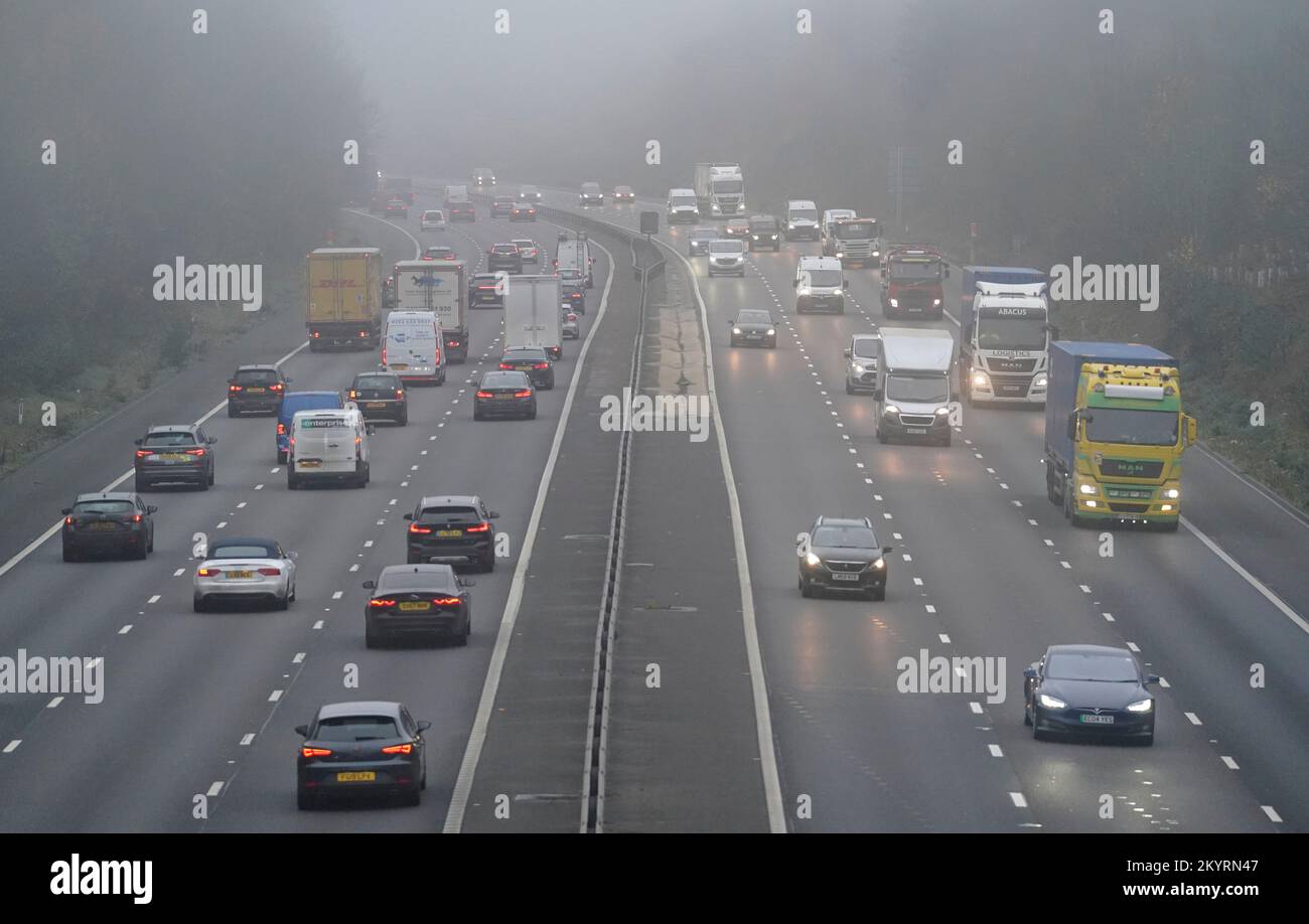 Vehicles drive through fog on the M3 near to Old Basing in Hampshire. Picture date: Friday December 2, 2022. Stock Photo