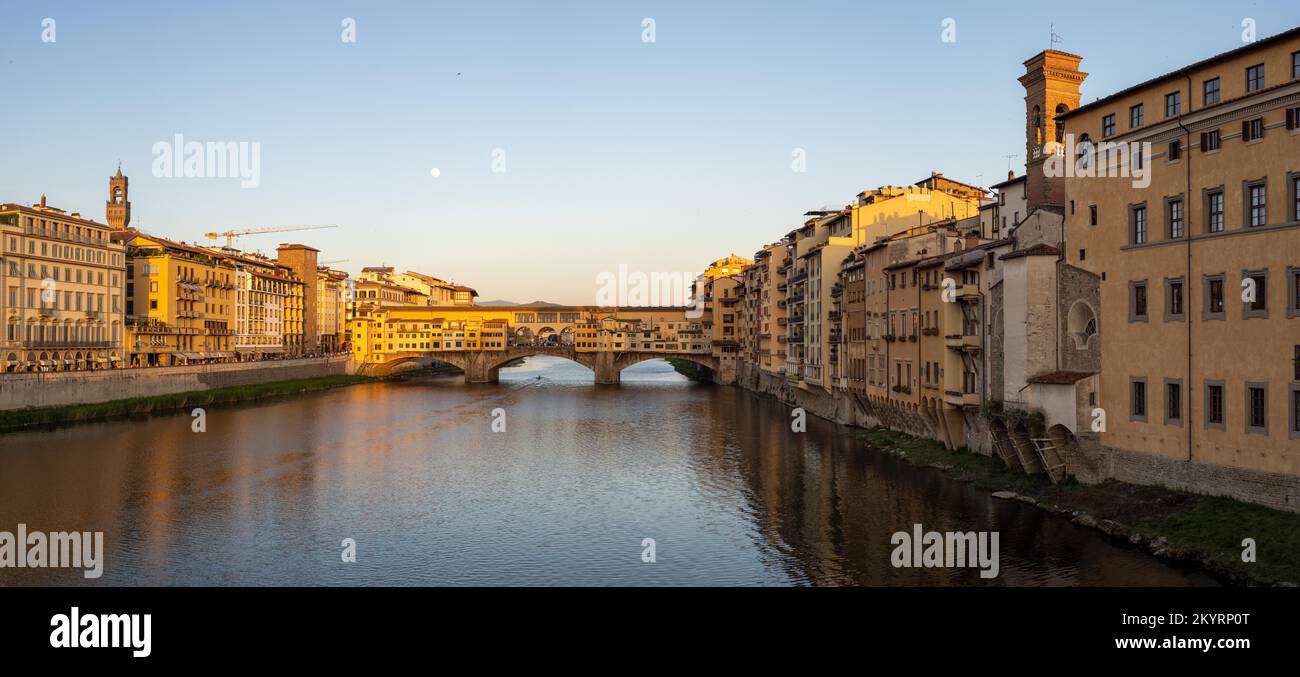 Evening atmosphere and full moon, Ponte Vecchio bridge over the river Arno, Florence, Italy Stock Photo