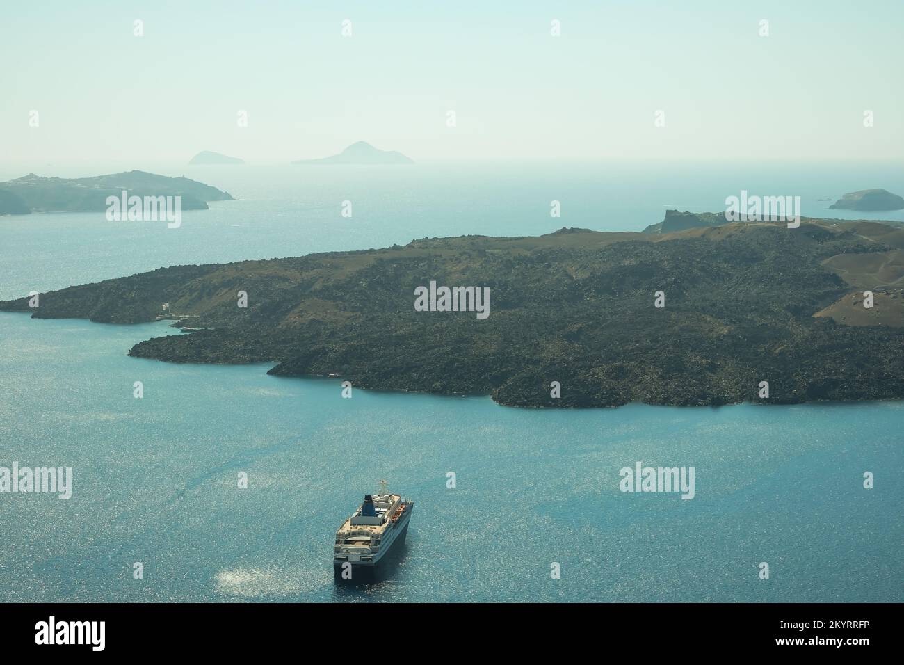 Santorini, Greece - September 16, 2022 : View of a cruise liner next to the famous volcano of Santorini Stock Photo