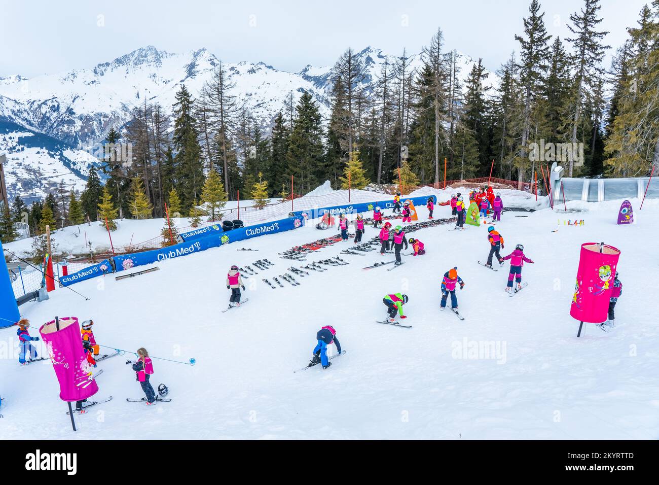 Les arcs, France - 15.02.2022 : ClubMed Les Arcs Panorama, teacher teach kid for skiing. Childrens outdoor activities, the children ski in the ski are Stock Photo