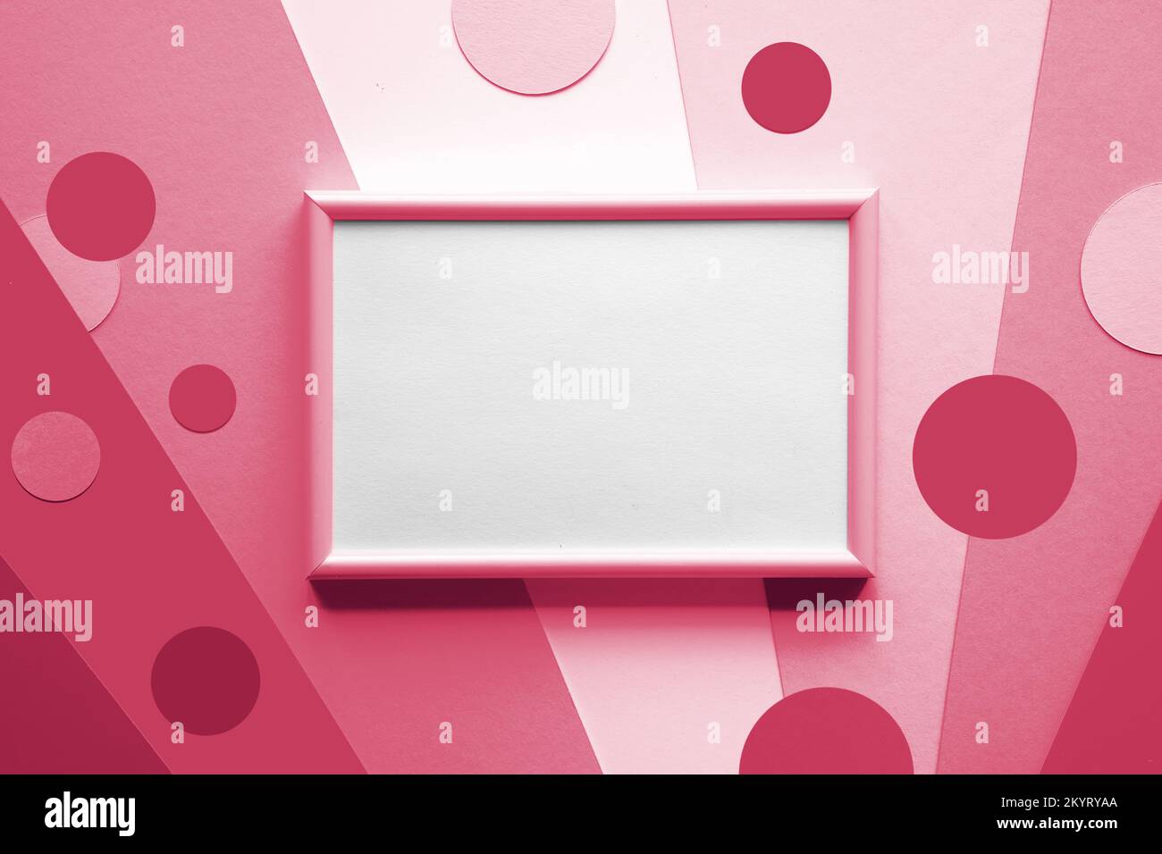 Blank pink white frame on layered colored paper with paper circles ...