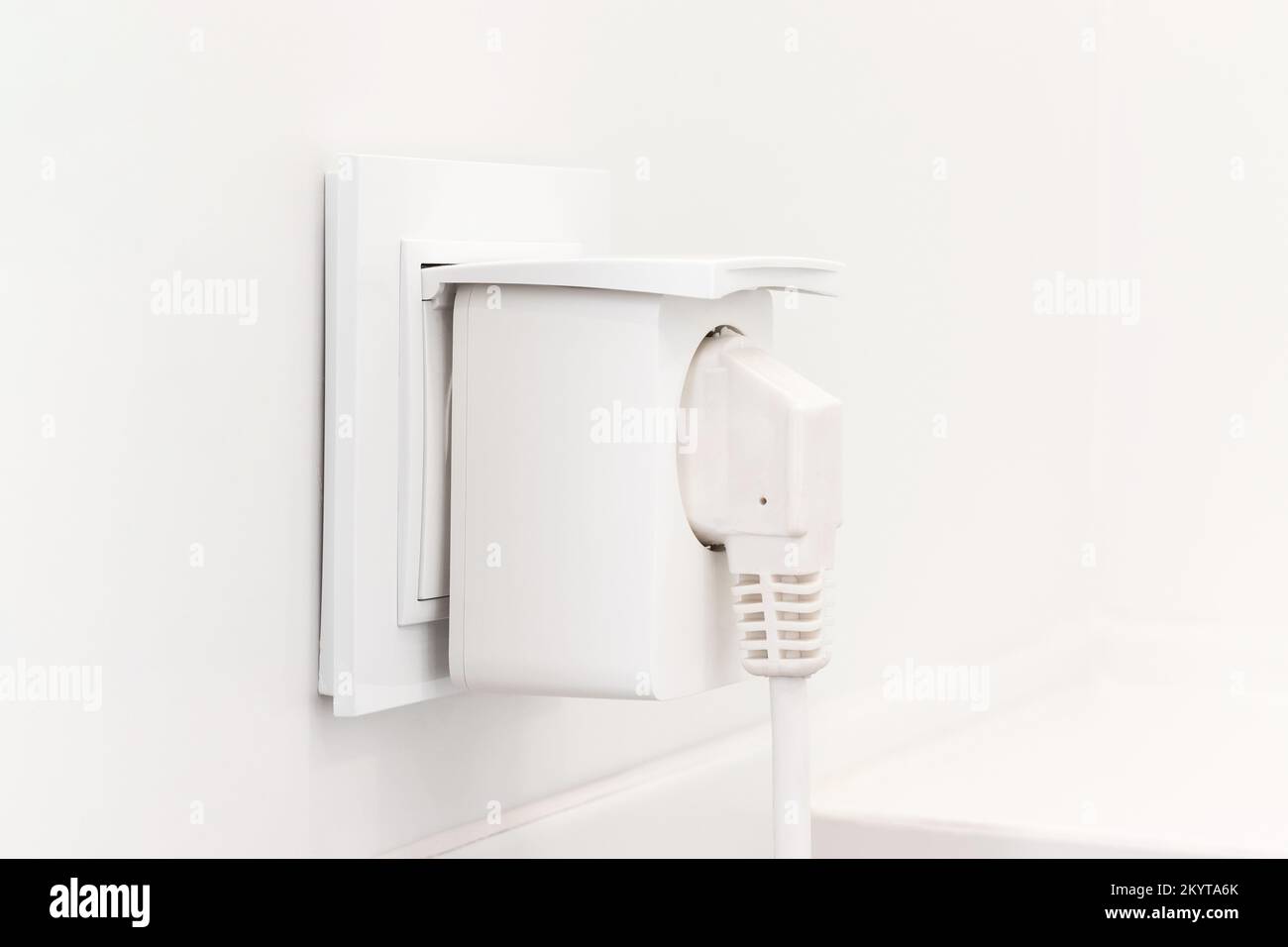 White european electrical outlet with smart plug inserted into it on