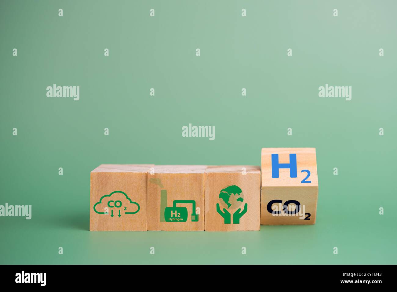 Hydrogen fuel is used to replace carbon dioxide, helping to reduce global warming. wood cube icon H2 hydrogen. Stock Photo