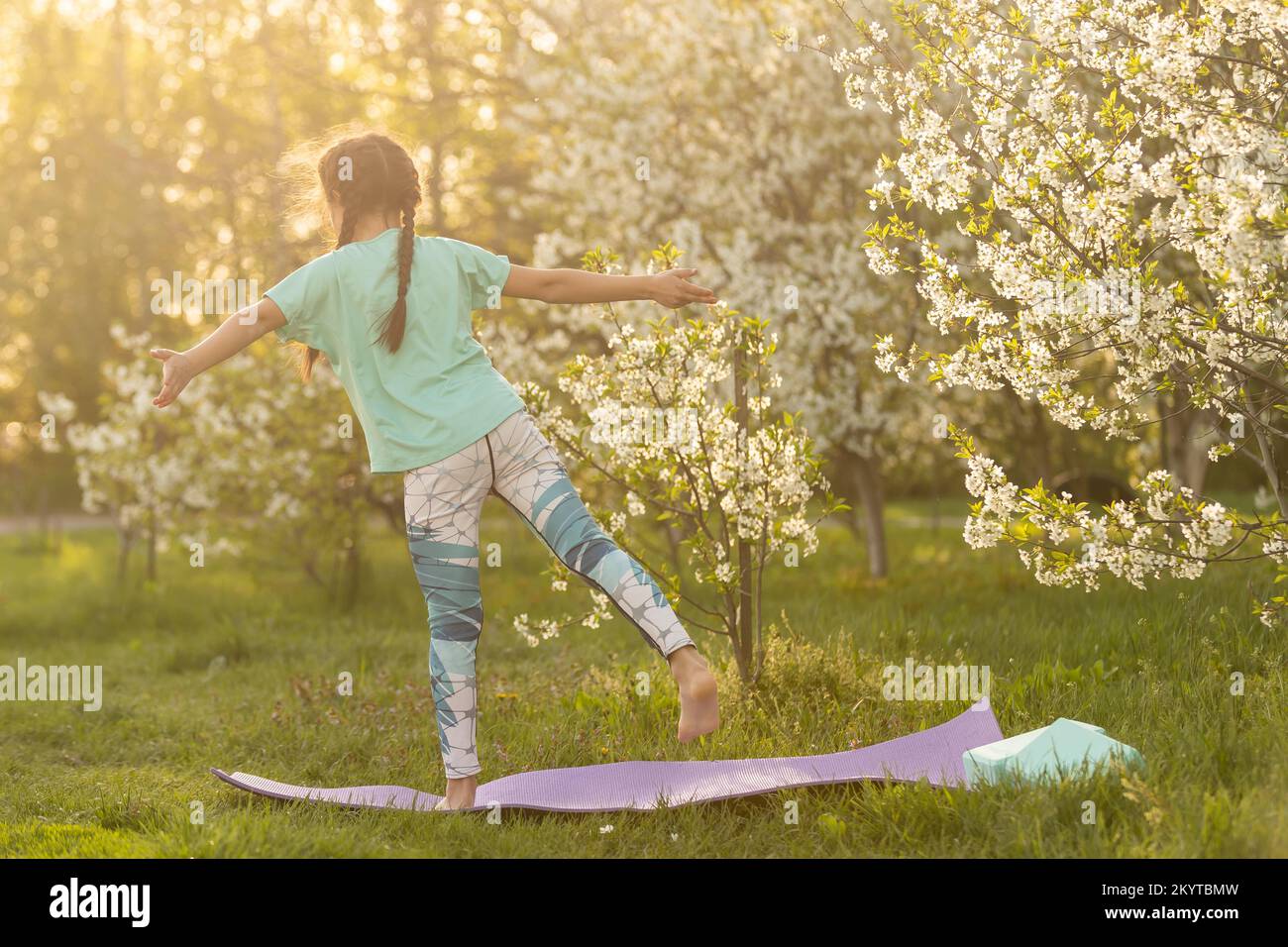 child doing gymnastics exercises. Sports, learning, fitness, stretching ...