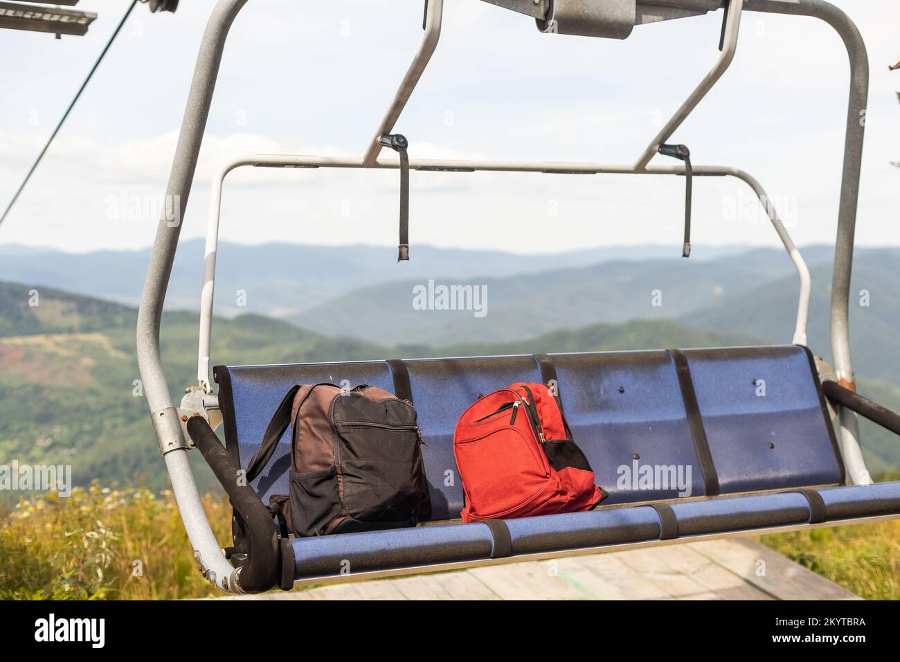 backpacks on the chair lift Stock Photo Alamy