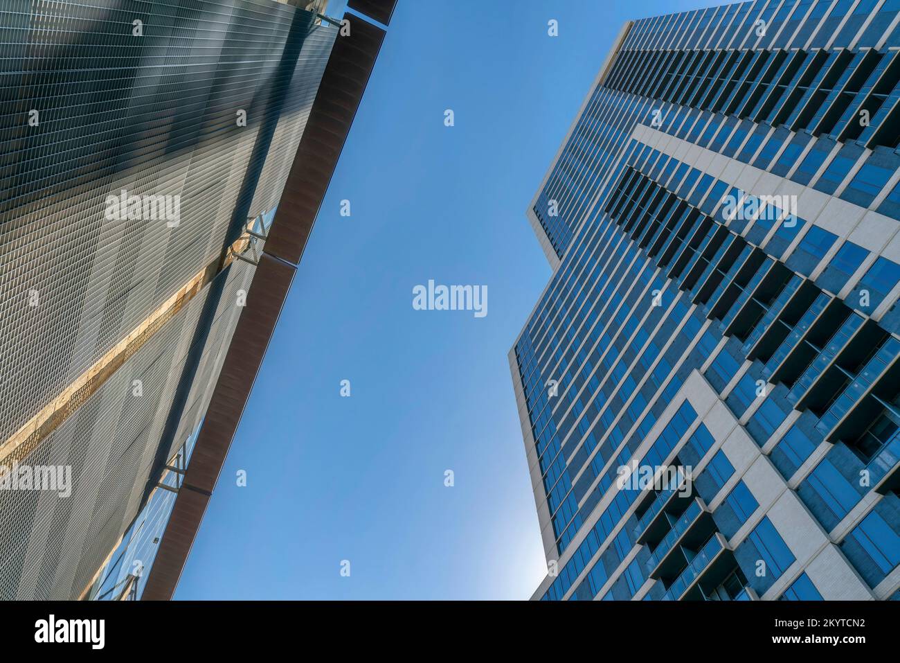 Austin, Texas- Two buildings across each other in a low angle view. There is a building on the left with metal wall across the building on the right w Stock Photo