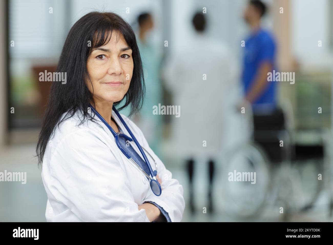 Confident older female doctor hi-res stock photography and images - Alamy