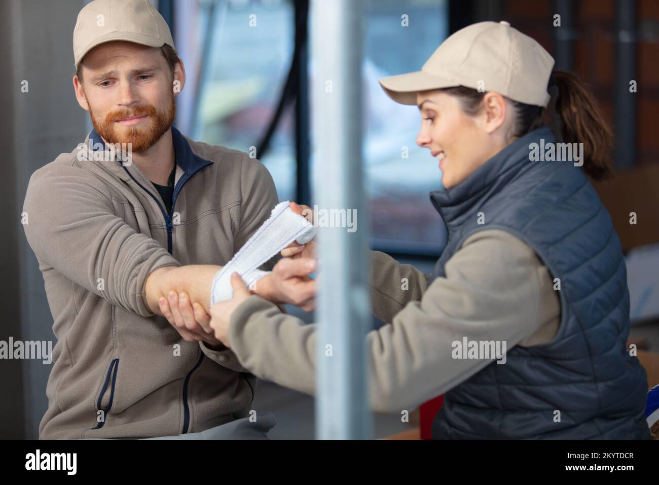 male and female construction workers Stock Photo