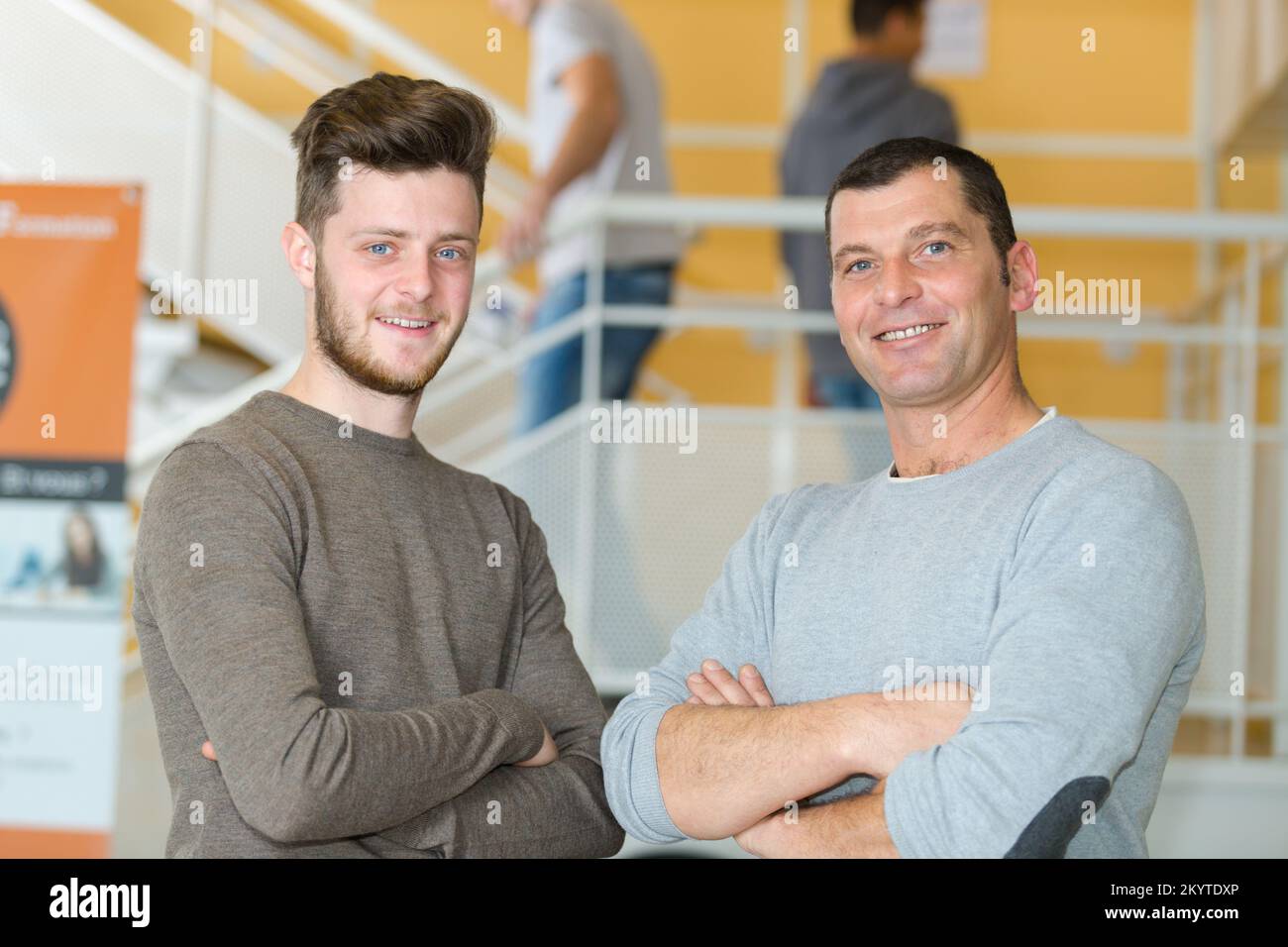 two collegues in a corridor Stock Photo - Alamy